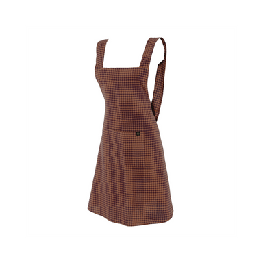 White background with a brown gingham apron. The Apron is made of a cotton linen blend and is by the brand Haomy. 