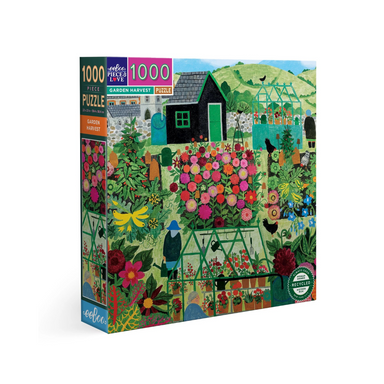 an image of a 1000 piece puzzle box set against a white background. The puzzle is an image of a back garden featuring a greenhouse, flowers, a vegetable patch, and a dragon shed. its cozy and vibrant looking!