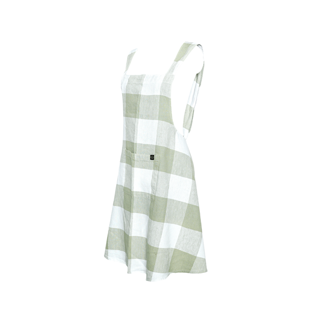 White background with a green plaid cotton linen apron. 