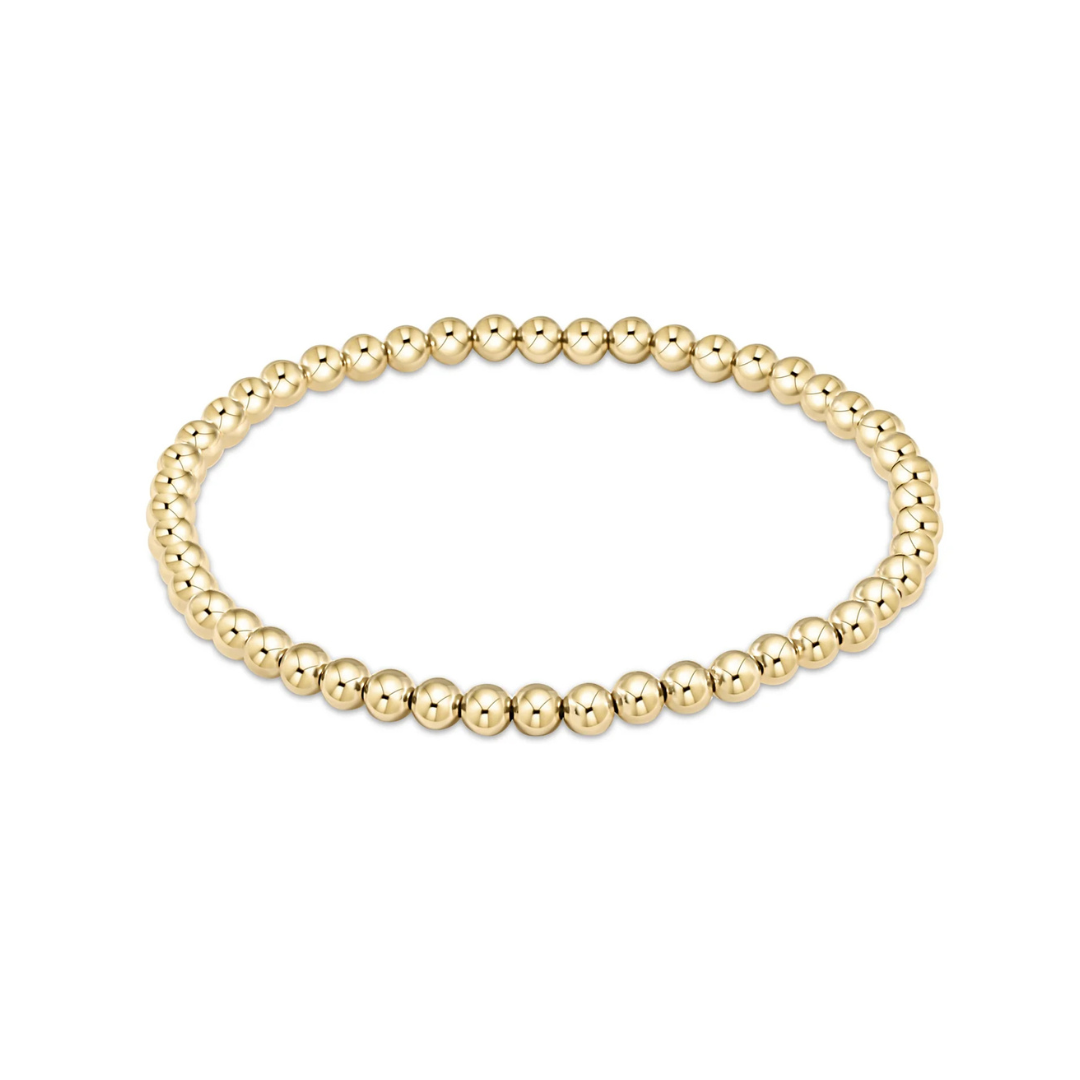 an image of a gold bead bracelet set against a white background. 