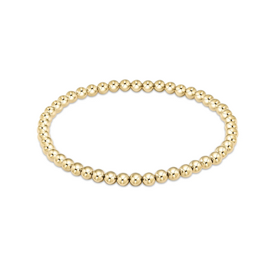 an image of a gold bead bracelet set against a white background. 