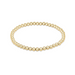an image of a gold bead bracelet set against a white background. 